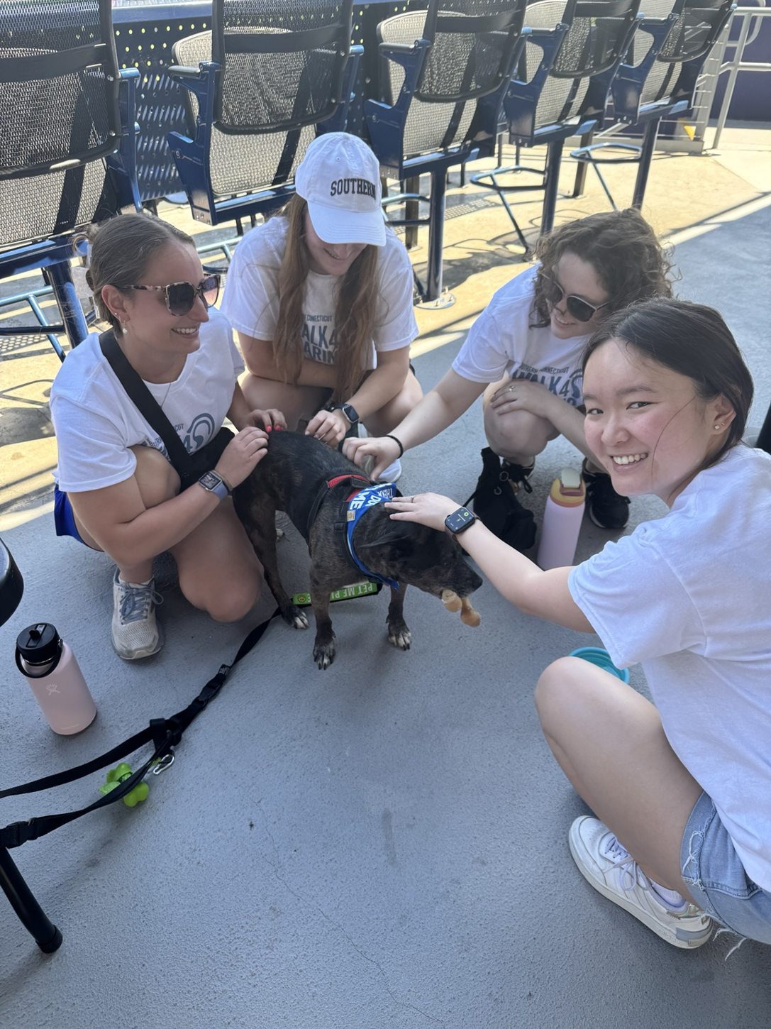 Oakley greeting adults at a baseball event